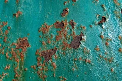 A rusty teal surface, with paint flaking Stockfoto's
