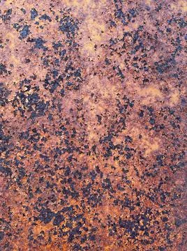 Rusty Texture. Dark worn textured metal surface close up. Stock Photos