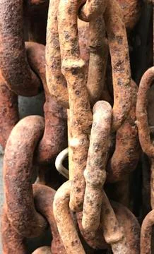 Rusty textured tangled chains rings background photo. Stock-Fotos