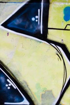 Rusty textured wall painted with bright colorful graffiti Illustrazione stock