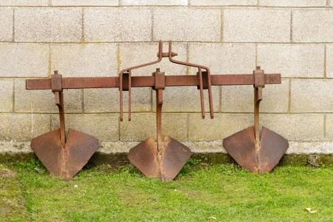 Rusty three blade plough attachment Stock Photos