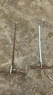 Rusty tools on dirt floor 스톡 사진