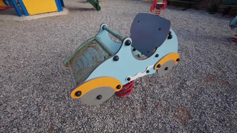 Rusty Toy Car in an Empty Playground 스톡 동영상 303399205