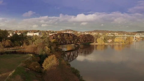 Rusty Train Bridge Extended Over River In Fall  Stock Footage 99002440