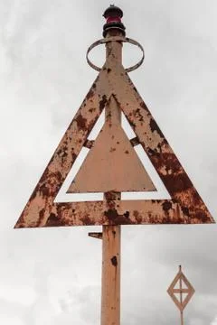 Rusty triangular navigation mark 스톡 사진