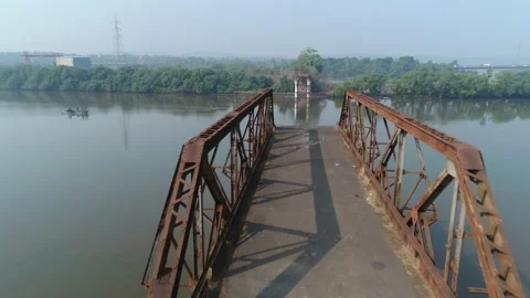 Rusty truss of the demolished bridge over the river. Aerial view. 스톡 동영상 85484424