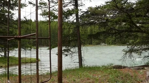 A rusty turnstile in front of a river Stock Footage 153115248