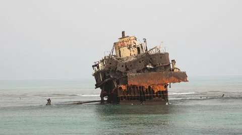 Rusty unknown shipwreck over the sea - Red Sea, Sudan Stock Footage 61092258