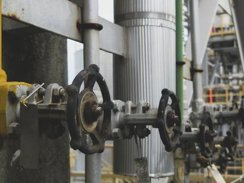 Rusty valve is attached to a pipe Stock Photos