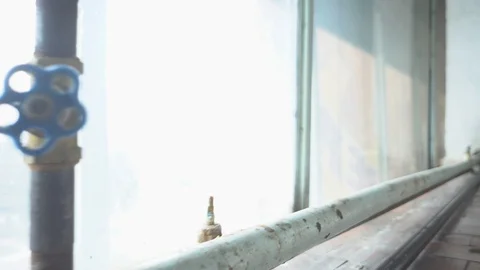 Rusty valve on a heating pipe Stock Footage 87860128