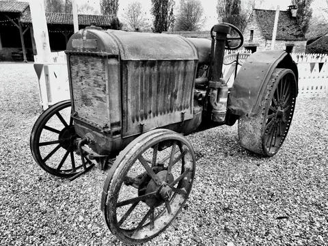 Rusty vintage tractor. Stock Photos