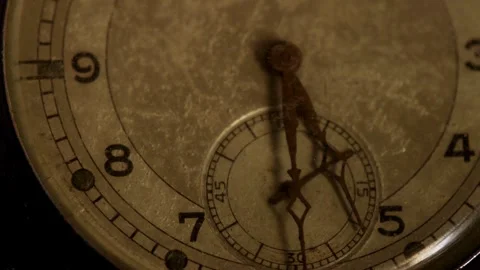 Rusty watch hands move across an old textured face Video stock 329598221