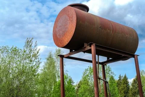 Rusty water barrel. Stock Photos