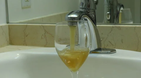 Rusty water flowing glass Stock Footage