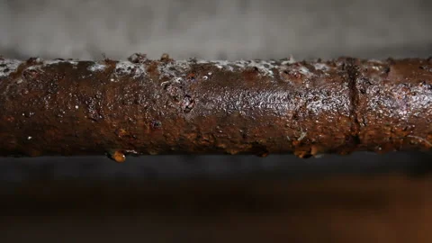 Rusty water pipe covered with condensate. Emergency pipes in the basement Stock Footage 320298325