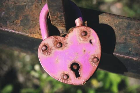 Rusty wedding lock in shape of heart Stock Photos