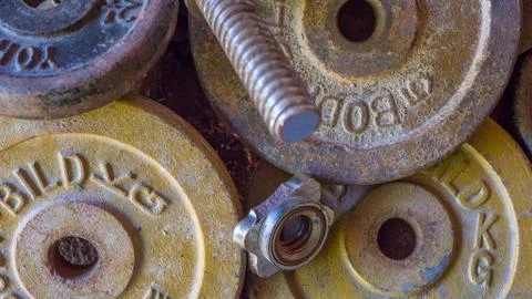 Rusty Weights slowly rust left abandoned on the floor Stock Photos