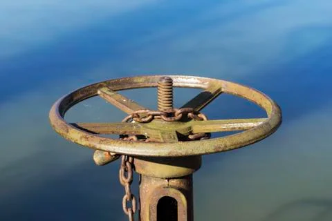 Rusty wheel by the pond Stock Photos