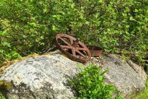 Rusty wheelbarrow wheel Stock Photos