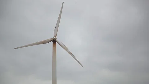 Rusty wind generator closeup, cloudy sky bg, rainy weather Stock Footage 97101160