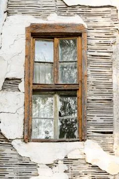 A rusty window of an abandoned house Stock Photos