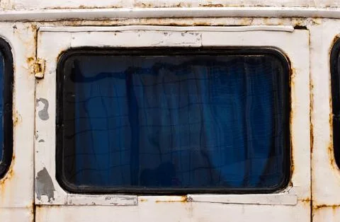 Rusty window of an old bus Stock Photos