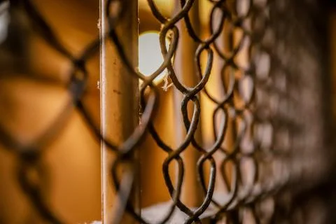 Rusty wire mesh around prison bars in Alcatraz Federal Penitentiary Stock Photos