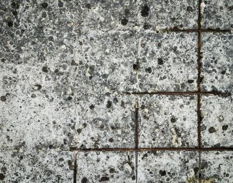 Rusty wire mesh in concrete Stock Photos