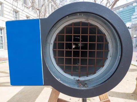 Rusty worn down pipe and grate with faint other side with empty display Stock Photos