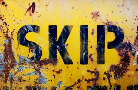 Rusty yellow skip Stock Photos