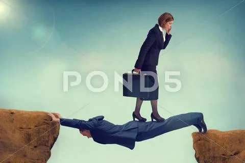 Ruthless business woman walking over a vulnerable businessman Stock Photos