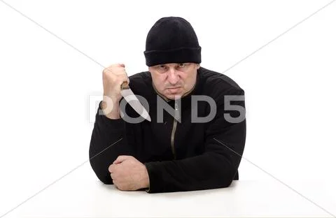 Ruthless psychopath with a knife in his hand Stock Photos