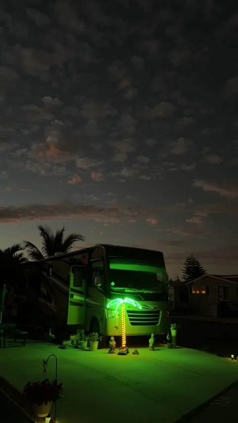 RV camper with green palm tree light celebrating Florida Christmas holidays Stock Footage 328974949