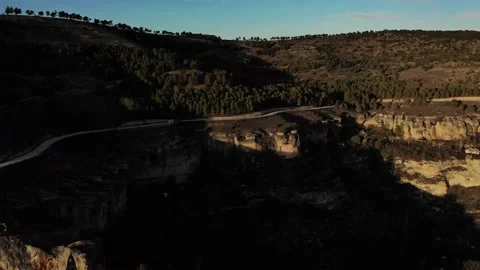 RV driving over cliffs at sunset 4K 8 Stock Footage 230958933