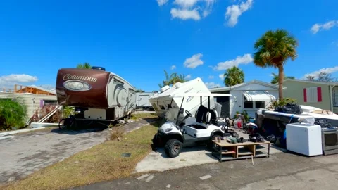 RV flipped over from heavy winds Hurricane Ian Fort Myers FL Stock Footage 216902472