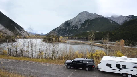 RV pickup and trailer in Crow's Nest Pass Alberta, panning Stock Footage 294262337