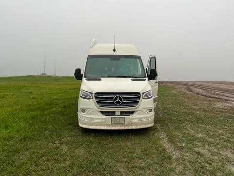 A RV Sprinter Van stuck in the mud in the Wall, SD boondocking spot in Badl.. Stock Photos