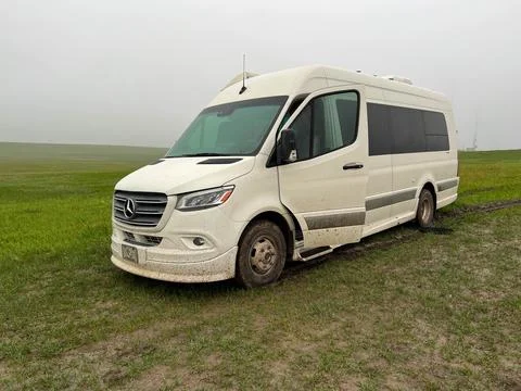 A RV Sprinter Van stuck in the mud in the Wall, SD boondocking spot in Badl.. Stock Photos