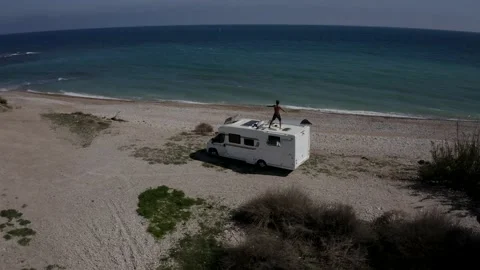 Rv Vacation, The man dancing on the Rv Playa  Aiguaoliva/ El Puntal, Spain Stock-Footage 130911164