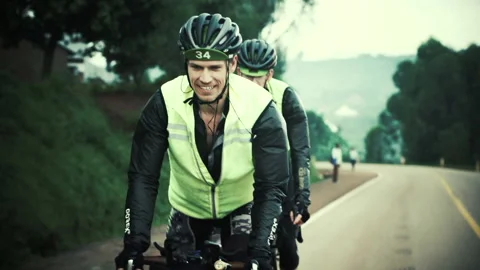 Rwanda - 3 September 2018: a cyclist rides and smiles Stock Footage 138628075