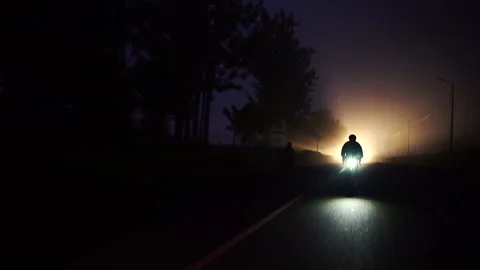 Rwanda - 3 September 2018: a cyclist rides in the middle of the night Stock Footage 138632148