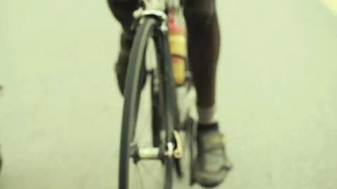 Rwanda - 3 September 2018: legs of an african cyclist pedaling Stock Footage 138632153