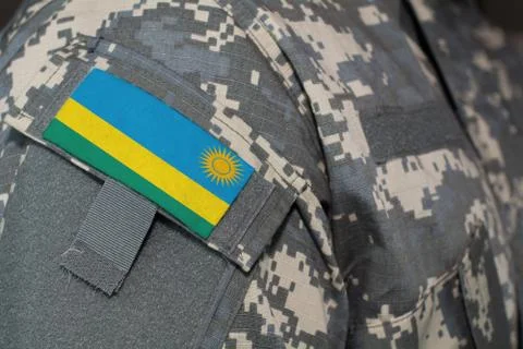 Rwanda army uniform patch flag on soldiers arm. Military Concept Stock Photos