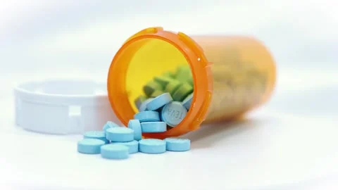 RX Blue Pills Spilled Level RtoL rotate Stock Footage 301363136