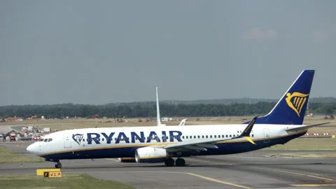Ryanair Boeing 737-800 passenger airplane taxiing past KLM aircraft Stock Footage 345787654