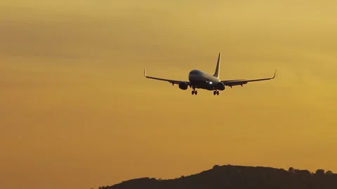 Ryanair Boeing 737 on final approach landing at sunset Stock Footage 337795580