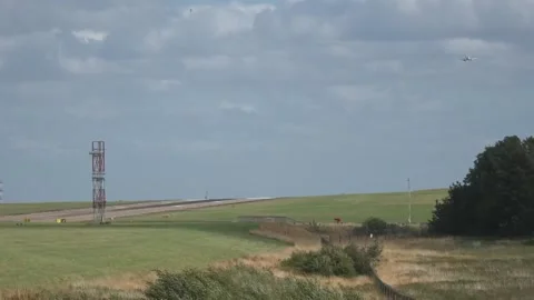 Ryanair flight makes wobbly approach to Leeds Bradford Airport amid Storm Flori Stock Footage 314278072