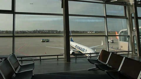 Ryanair plane shot from inside terminal area, empty seats. Stock Footage 121392308