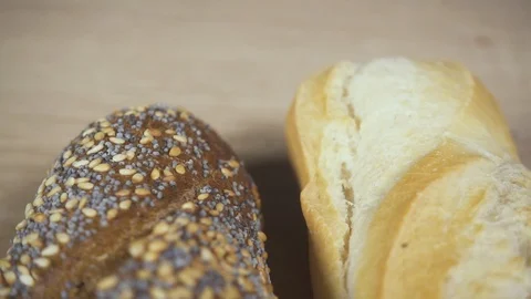 Rye and white bread on the table the camera is moving Stock Footage 87979837