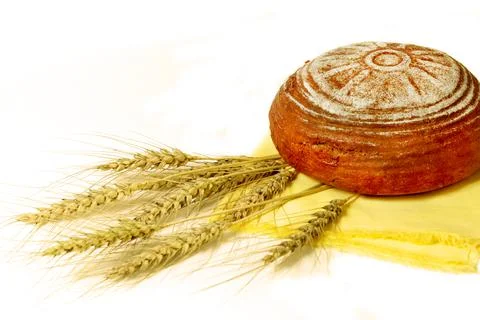 Rye bread and ears of rye on a white background. selective focus Stock Photos
